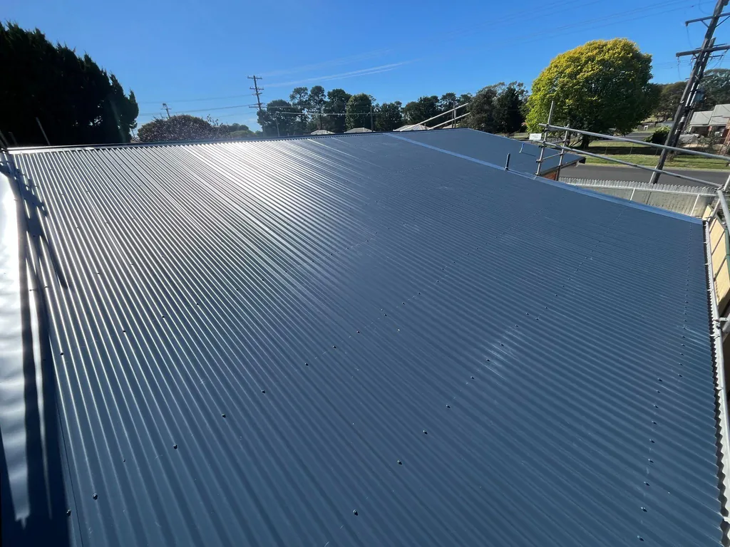 After: new dark metal roof