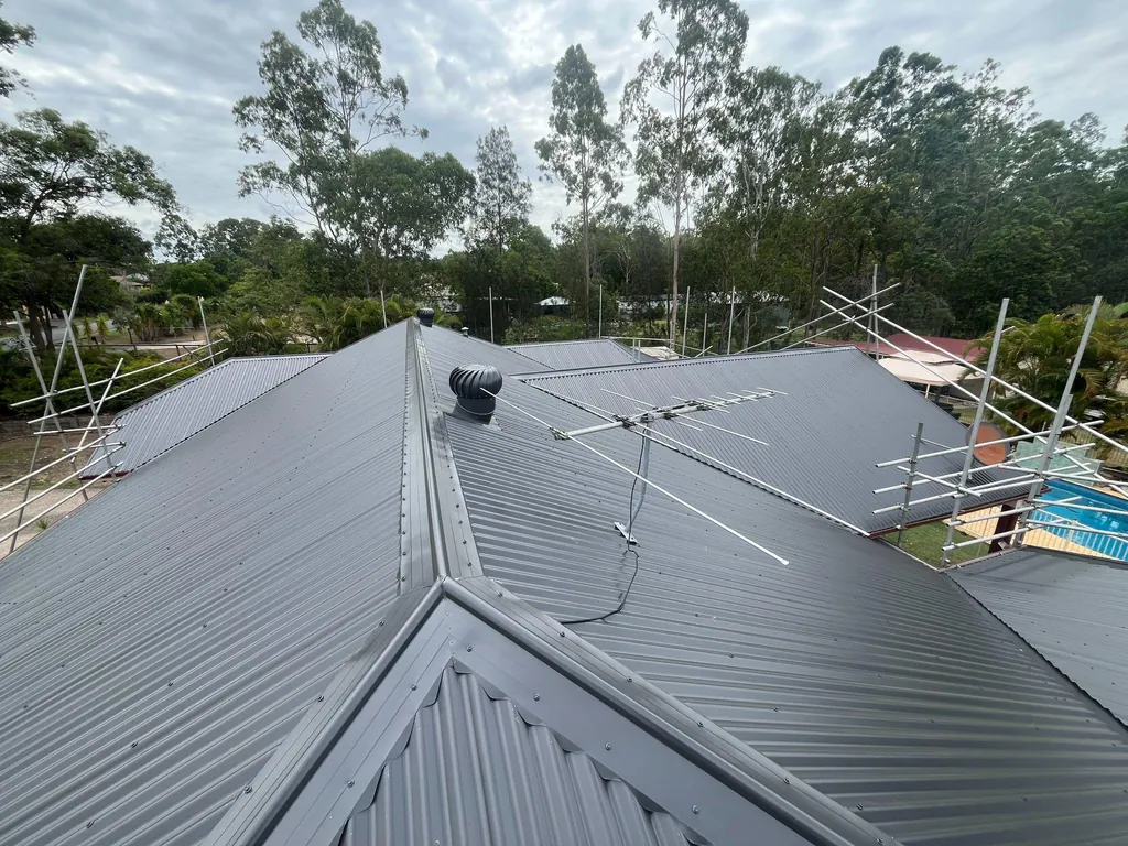 After: new grey metal roof