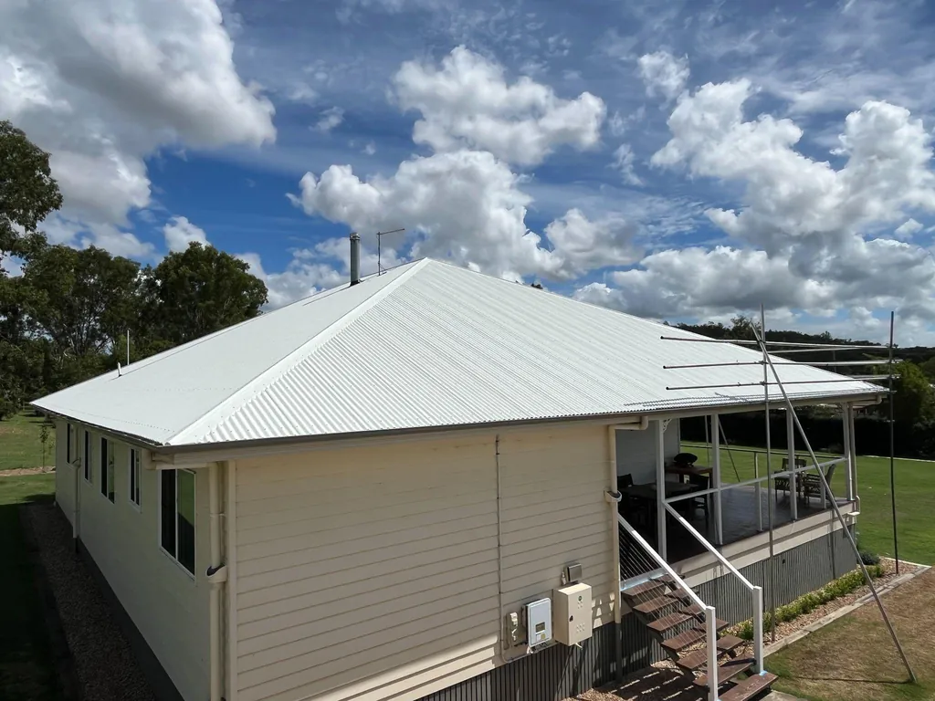 Before: original roof on a raised house